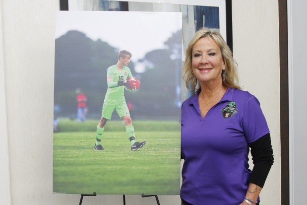 Tammy McGee with a photo of her son Joseph Connor Guido, who was killed in 2019 in a York County car crash. (James W. Robinson/The Virginia Gazette)