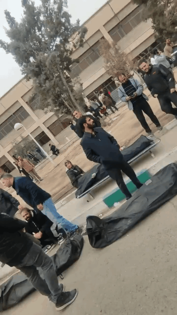 A horrific video that illustrates the massacre in Iran of its own citizens. People arriving at the morgue and the entire area, parking lot, and compound are filled with bodies. This is just one small city, on one day alone. And this is not the full video.
