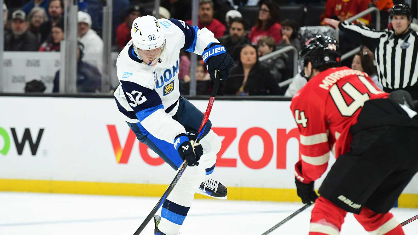 Team Finland forward Patrik Laine (92) shoots the puck while Team Canada defenseman Josh Morrissey (44) defends during the second period in a 4 Nations Face-Off ice hockey game at TD Garden.