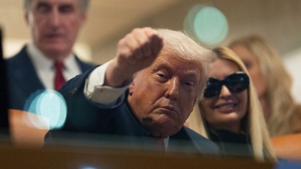 President Donald Trump gestures to fans while attending the College Football Championship at Hard Rock Stadium in Miami Gardens, Fla., on Monday, Jan. 19, 2026. (Allison Robbert/The New York Times)