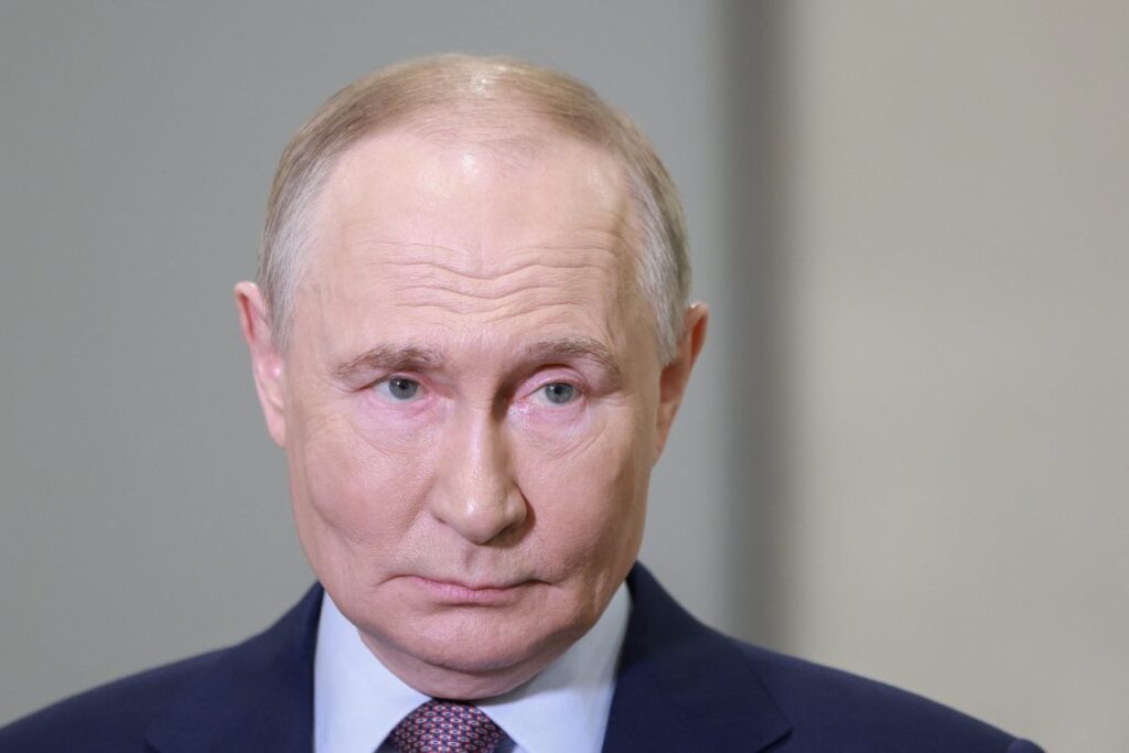 Russian President Vladimir Putin discusses military export expansion during a recent address, claiming over $15 billion in revenue despite Western sanctions. (Photo Credit: SHCHERBAK / POOL / AFP)