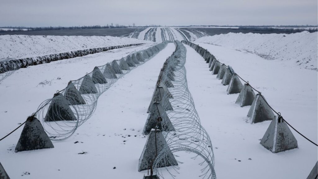 Razor wire and anti-tank “dragon’s teeth” on a Ukrainian line of defense in the Donbas region of Ukraine, Jan. 5, 2026. European leaders began meeting on Tuesday in Paris for the latest round of talks on peace for Ukraine, focusing on security commitments for the country in a potential cease-fire with Russia. (Tyler Hicks/The New York Times)