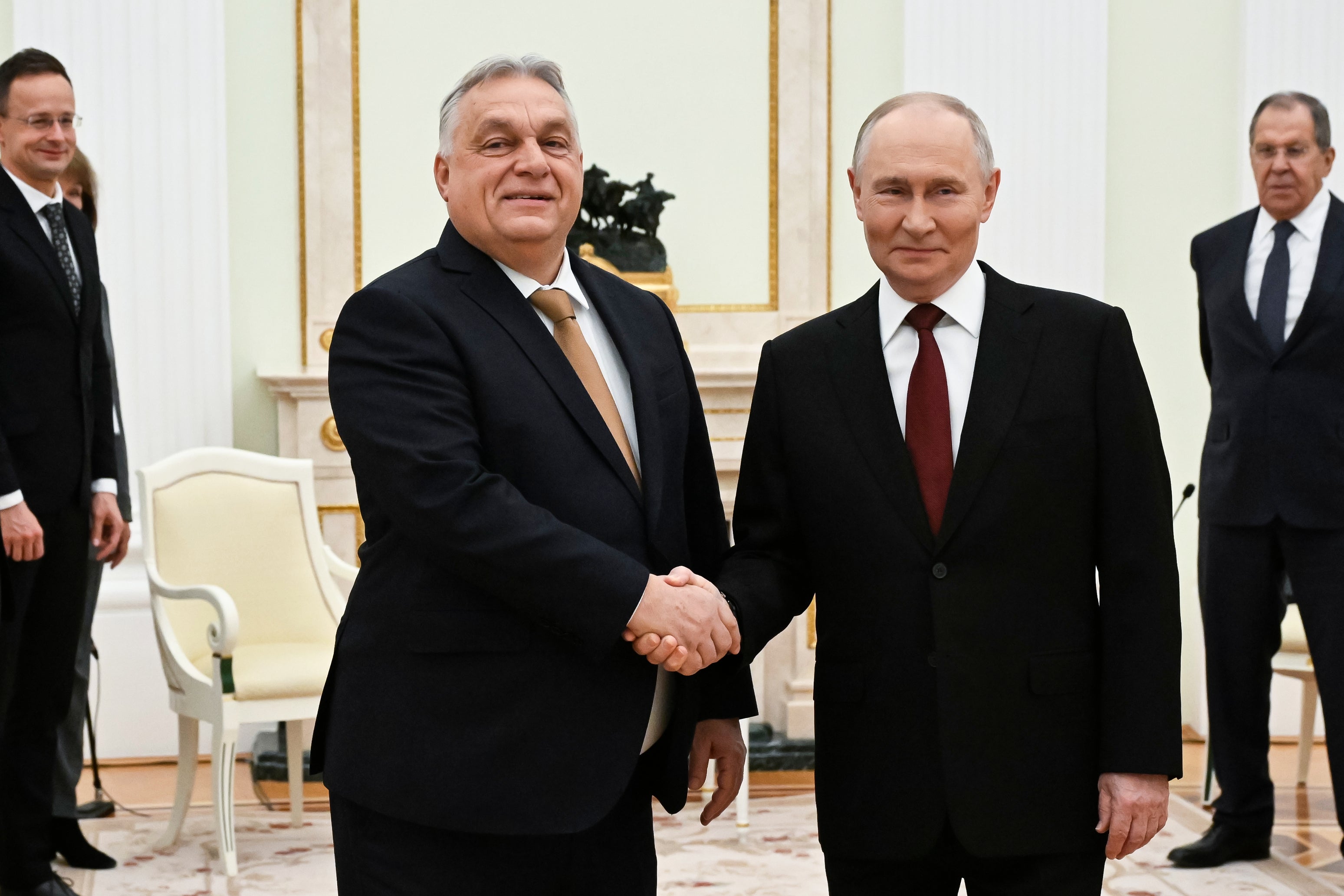Russian President Vladimir Putin, right, and Hungarian Prime Minister Viktor Orban shake hands during their meeting at Kremlin in November 2025.