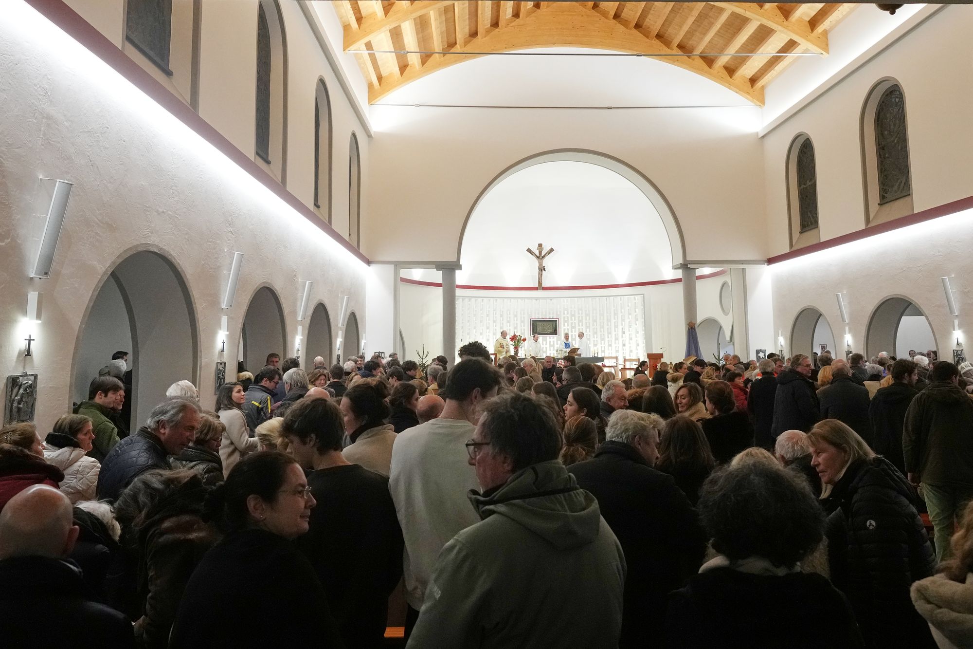 Mourners have attended a vigil at a church in the ski resort of Crans-Montana