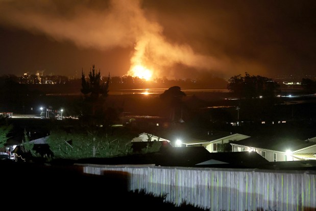 Fire blazed on January 16 at the Vistra power plant's battery storage facility in Moss Landing in northern Monterey County. Highway 1 was closed and evacuations were ordered in Moss Landing and the Elkhorn Slough area. (Shmuel Thaler - Santa Cruz Sentinel)