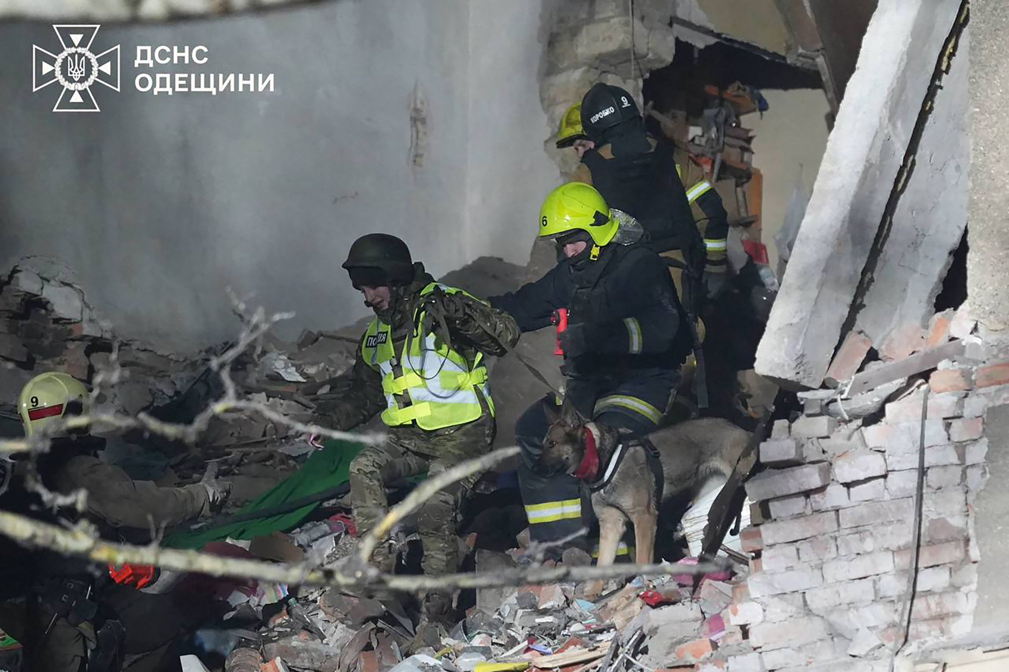 Ukrainian Emergency Service on January 27, 2026, a Ukrainian police officer with a disaster-trained search dog and Ukrainian rescuers work among the rubble of a heavily damaged residential building following an air attack in Odesa, amid the Russian invasion of Ukraine