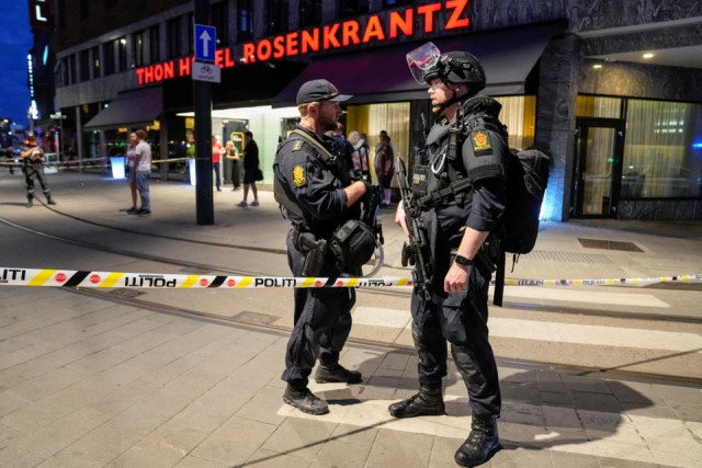 Norway jails Pak man for 30 years security forces stand at the site where several people were injured during a shooting outside the london pub in central oslo norway june 25 2022 reuters