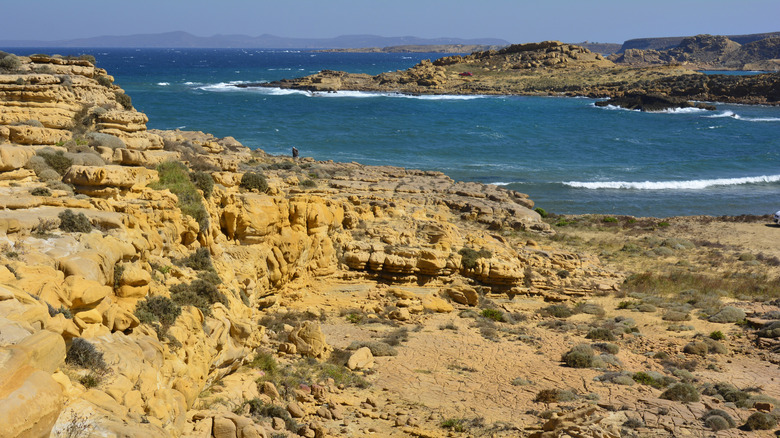 Faraklo yellow volcanic rock formations blue sea Limnos