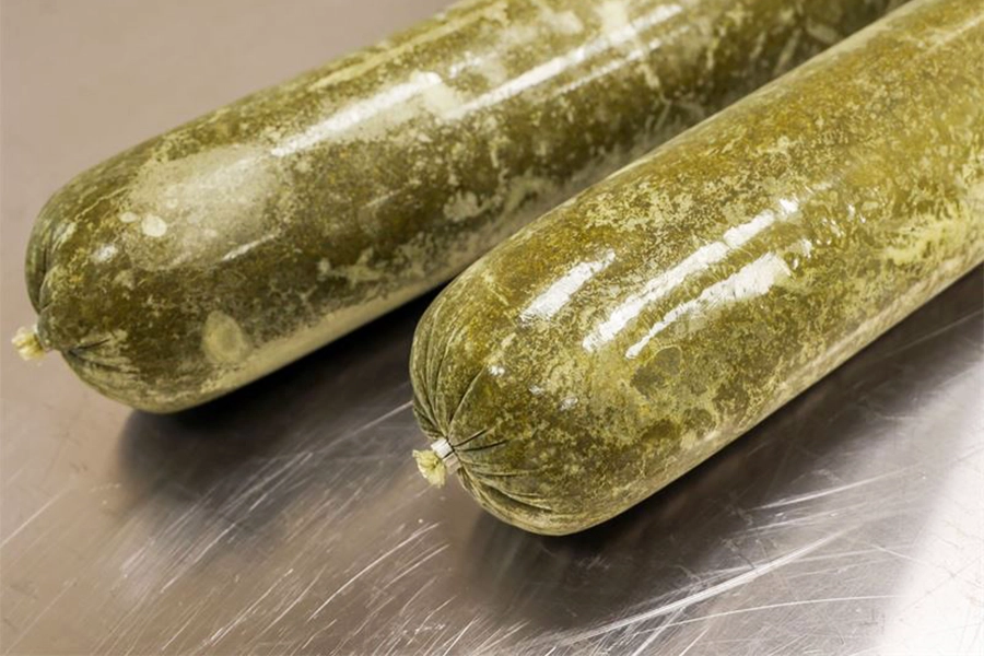 Chopped, heat-treated, and packaged broccoli leaves.