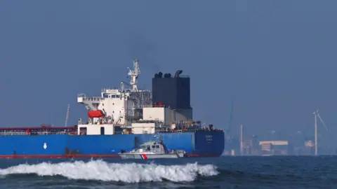Reuters A French navy boat alongside the GRINCH oil tanker, intercepted by France in the Alboran Sea on suspicion of operating under a false flag and belonging to Russia's shadow fleet.