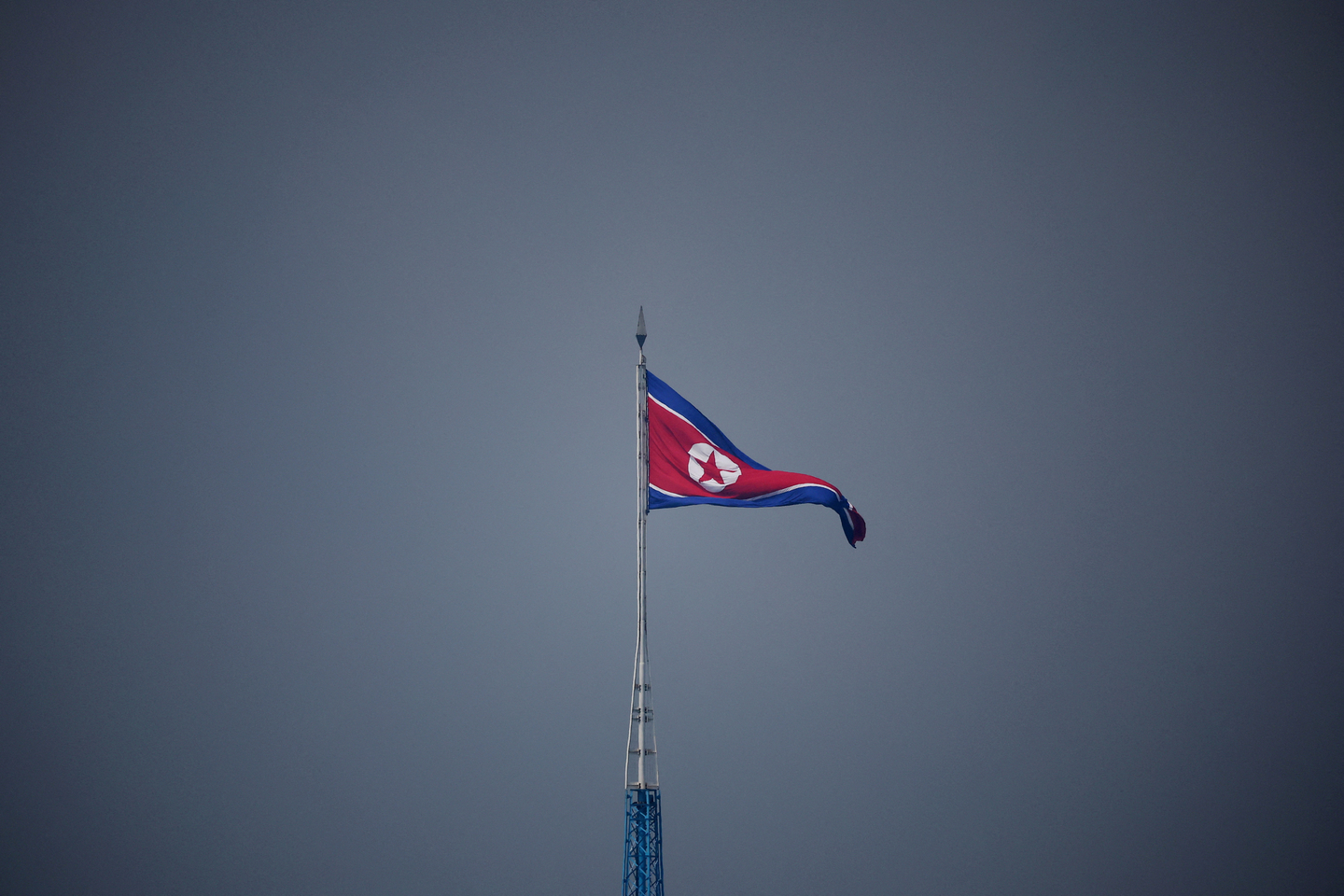 A North Korean flag flutters at the propaganda village of Gijungdong in North Korea, in this picture taken near the truce village of Panmunjom inside the demilitarized zone separating the two Koreas in South Korea on July 19, 2022. [REUTERS/YONHAP]