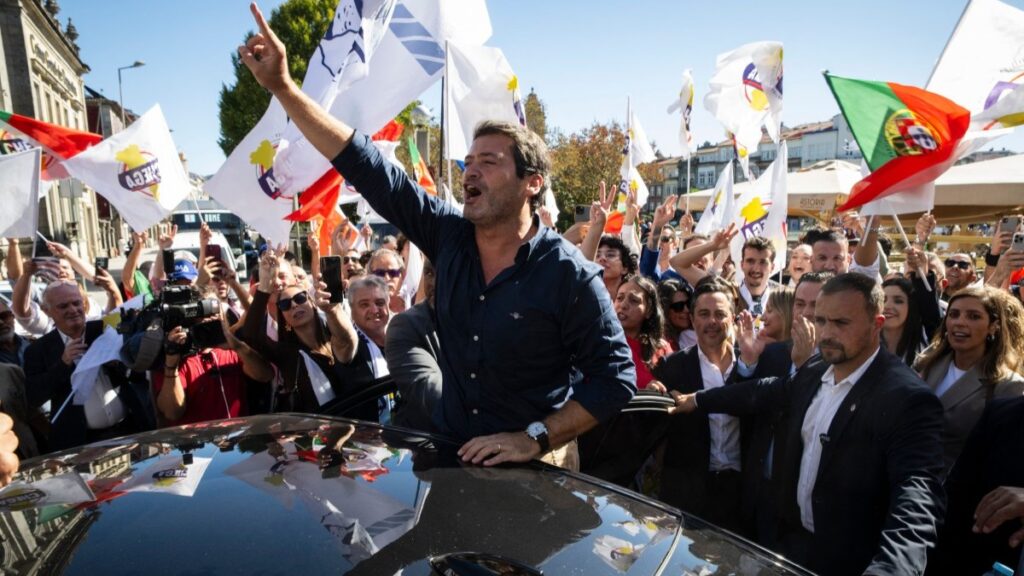 Chega leader André Ventura (C) gestures during a campaign rally in Braga, northern Portugal, on October 10, 2025, ahead of municipal elections.