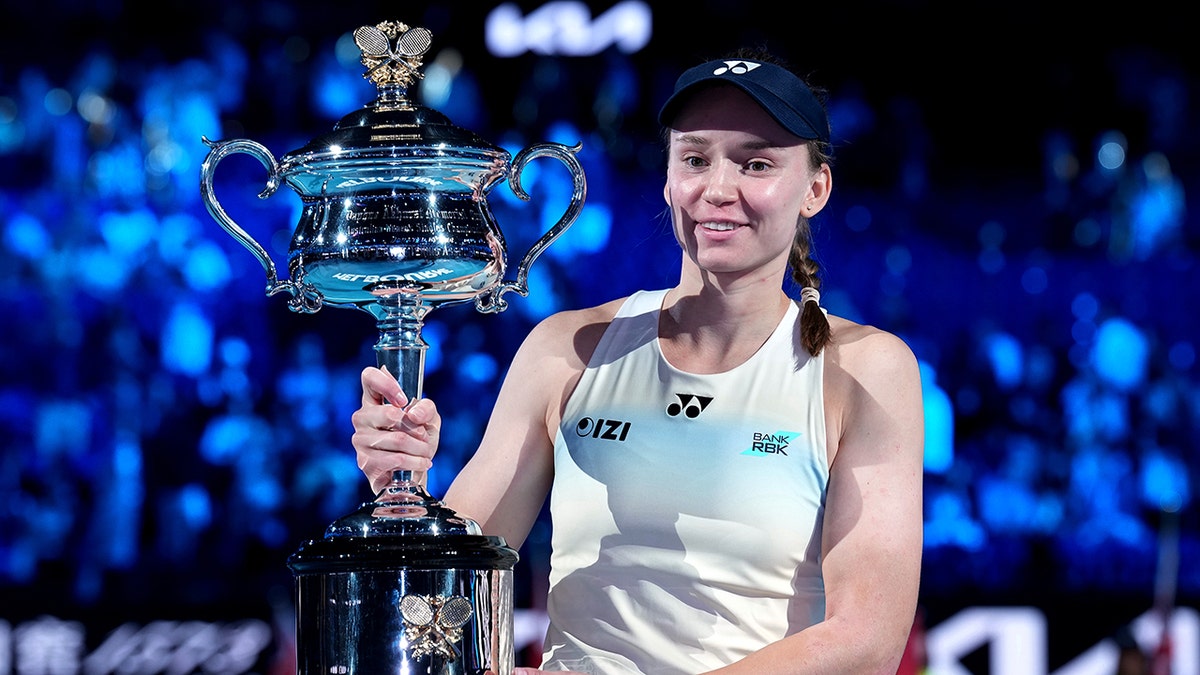 Elena Rybakina holds trophy
