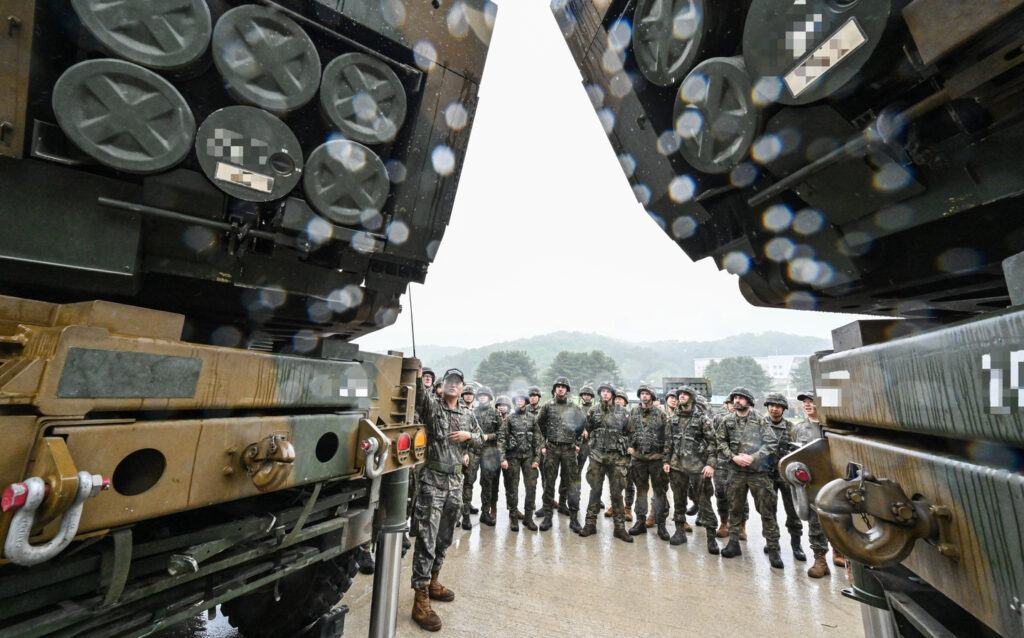Polish military officers listen to an explanation on the Chunmoo multiple launch rocket system during a demonstration on the K-defense system for soldiers from major overseas defense cooperation countries on May 22, 2025. [YONHAP]