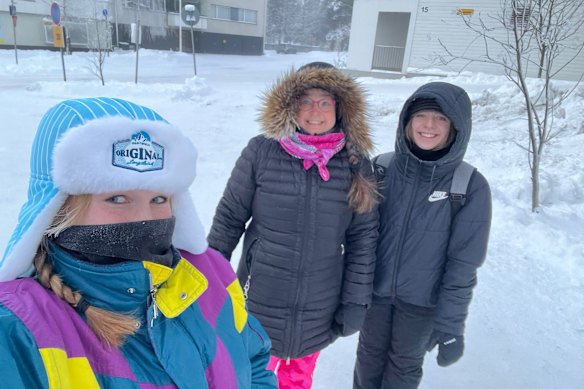 Snow worries: Marley Hines, right, standing with her host family “sister” Tanja, left, and host “mum” Marjo, centre, in Rovaniemi, Finland. 