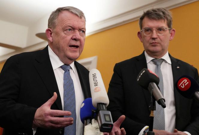 Danish Foreign Minister Lars Lokke Rasmussen (L) and Defense Minister Troels Lund Poulsen talk to media in Christiansborg Palace in Copenhagen, Denmark, January 21, 2026.