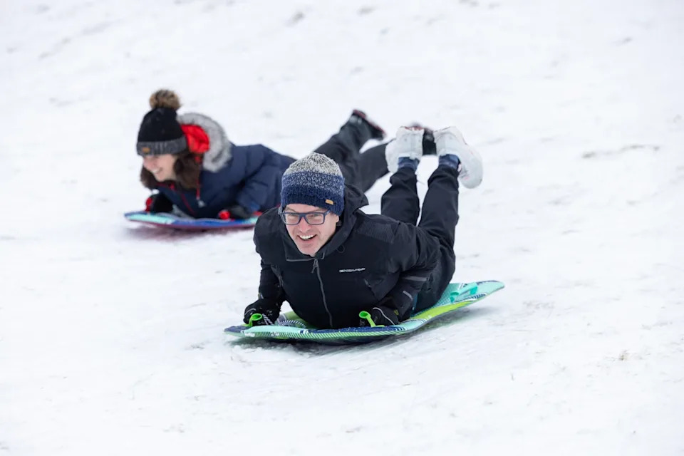 People sledging in Loch Morlich, Aviemore (Paul Campbell/PA Wire) (PA)