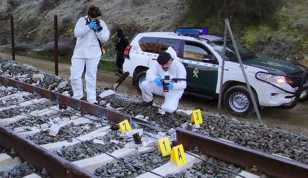 Civil agents working at the site where a high-speed Iryo train derailed and hit another train in Adamuz, Spain, on Monday. Photo: Guardia Civil/AFP Civil agents working at the site where a high-speed Iryo train derailed and hit another train in Adamuz, Spain, on Monday. Photo: Guardia Civil/AFP