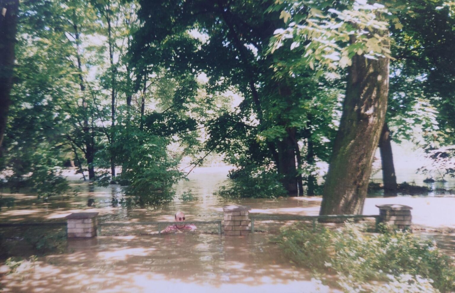 My uncle was fetching a bottle from/to his friend's flooded house, Opole, 1997.