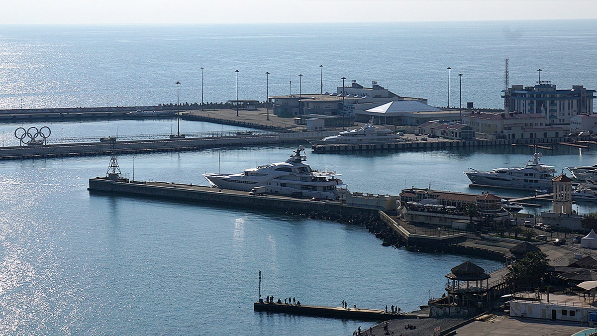 massive yacht docked at ocean pier