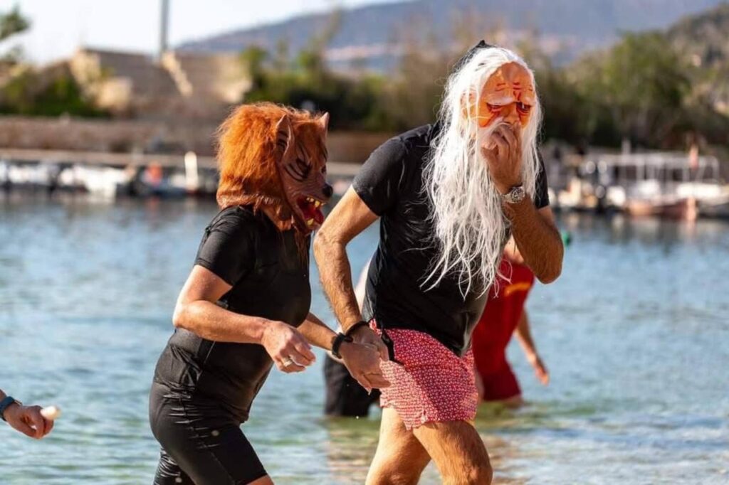Foreign residents wearing eye-catching costumes swim and walk in the sea during New Year celebrations in Antalya’s Kas district, Türkiye, Jan. 2, 2026. (AA Photo)