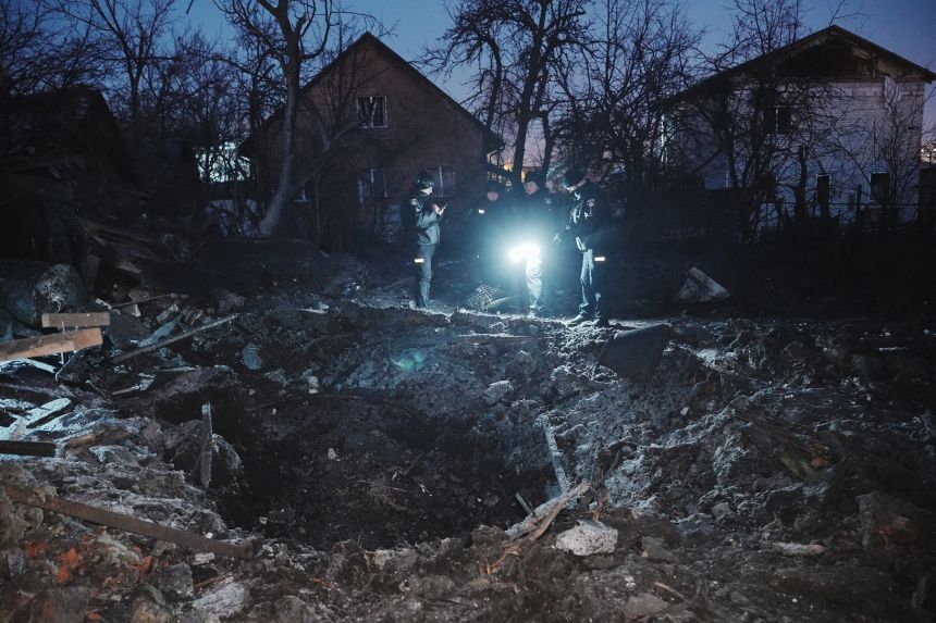 Police and rescuers work at the site of a Russian strike in Kharkiv, Ukraine, on January 19.