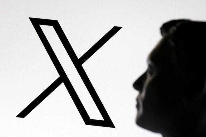 A figurine of Elon Musk photographed in front of the logo of social network X, January 23, 2025.