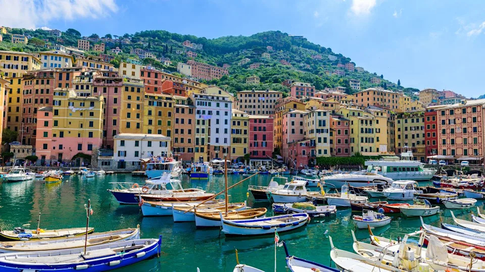 Camogli town in Liguria, Italy. Scenic Mediterranean riviera coast. Historical Old Town Camogli with colorful houses and sand beach at beautiful coast of Italy.