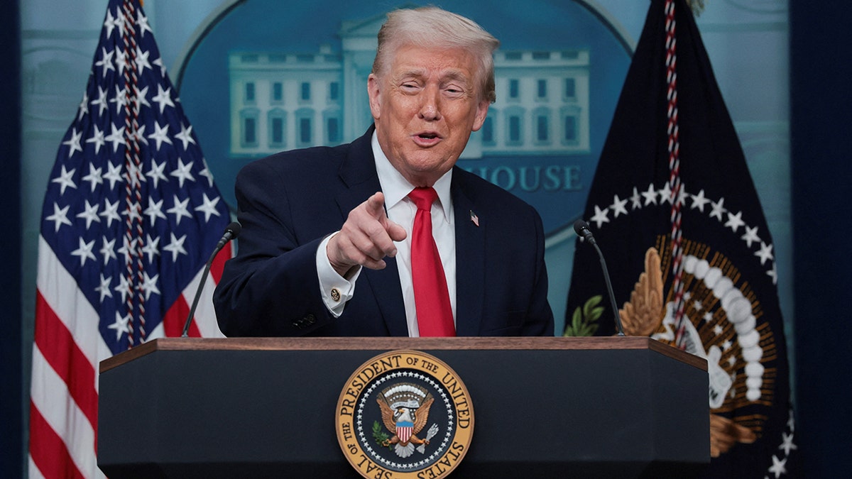 President Donald Trump points finger during White House press briefing