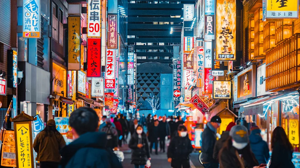Kabukicho, Tokyo Tokyo, Japan, entrance at night with pedestrians crossing the street