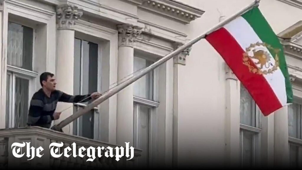 Protester tears down Iranian regime flag from London embassy