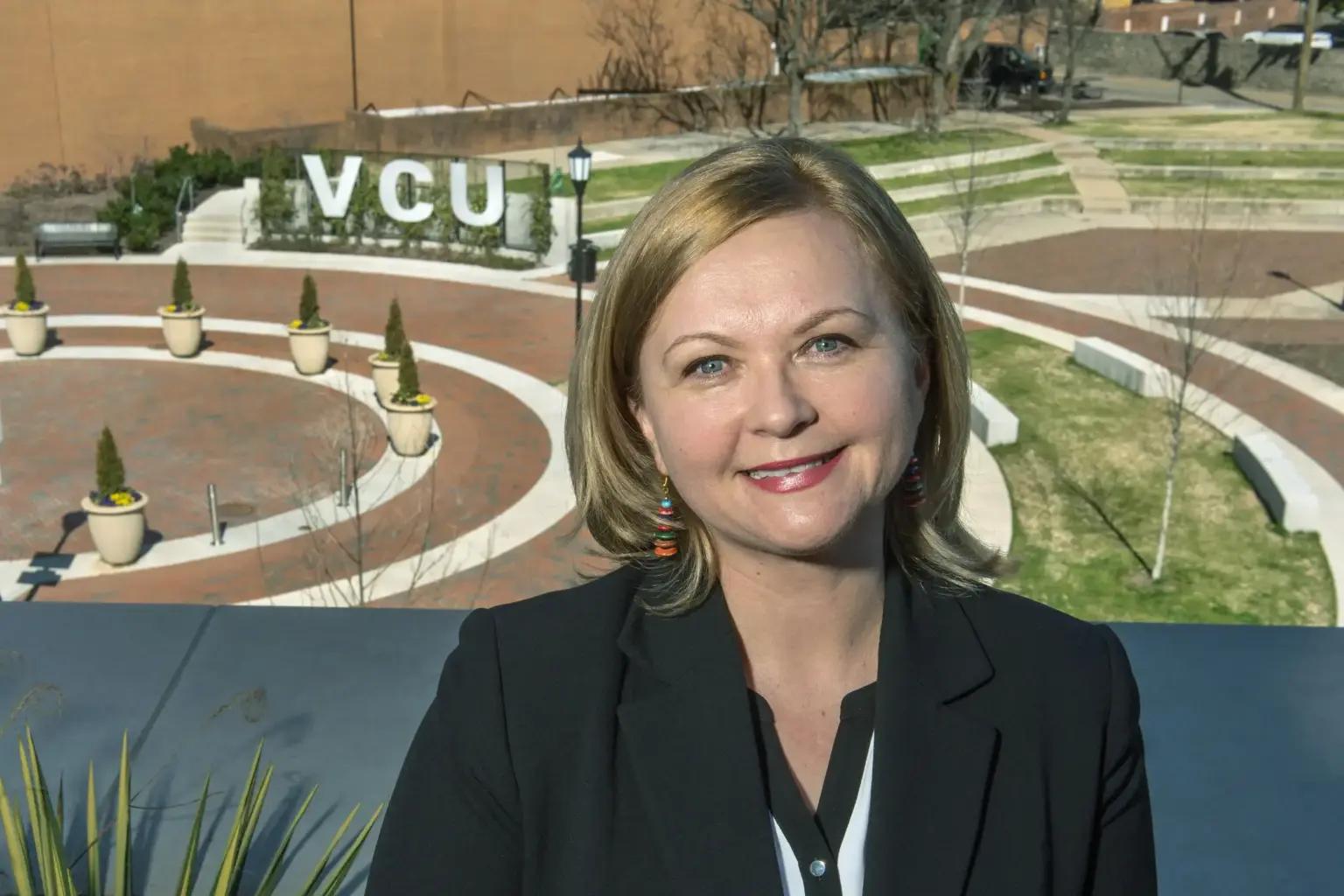 A photo of a woman from the shoulders up.
