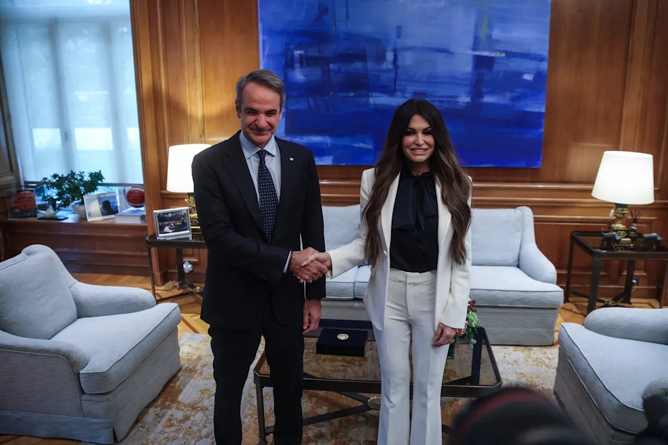 Greece's Prime Minister Kyriakos Mitsotakis greets the new United States Ambassador to Greece Kimberly Guilfoyle at Maximos Mansion in Athens, Greece on November 5, 2025. (Photo by Aris Oikonomou / Aris Oikonomou / SOOC / SOOC via AFP) (Photo by ARIS OIKONOMOU/Aris Oikonomou / SOOC/AFP via Getty Images)