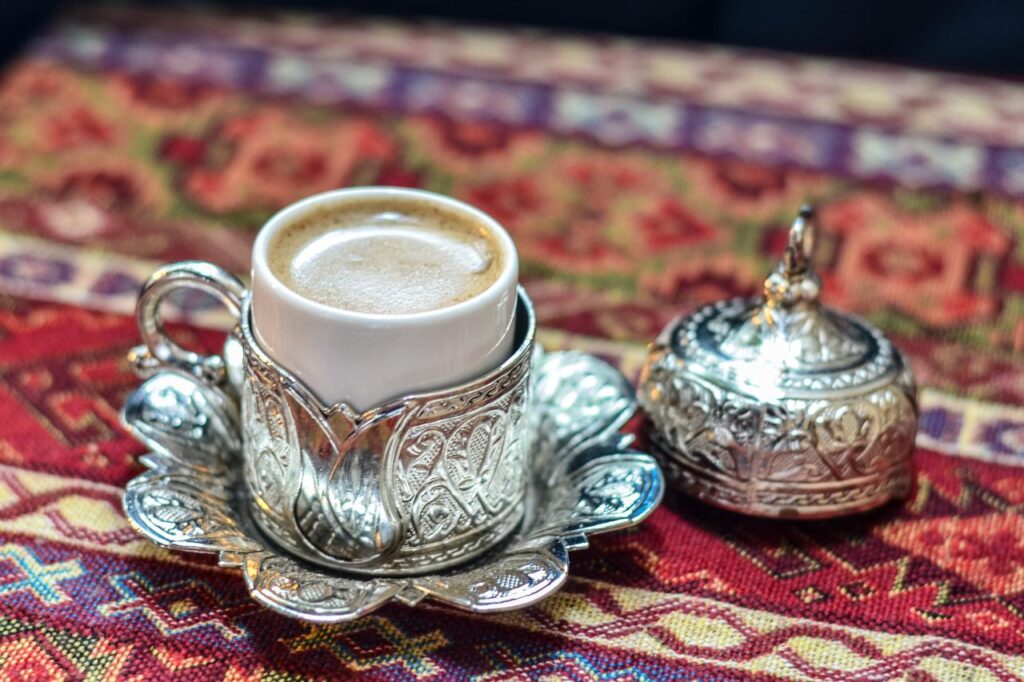 A foamy cup of menengic coffee rests in an engraved metal saucer, Gaziantep, Türkiye, accessed on January 12, 2026. (Adobe Stock Photo)
