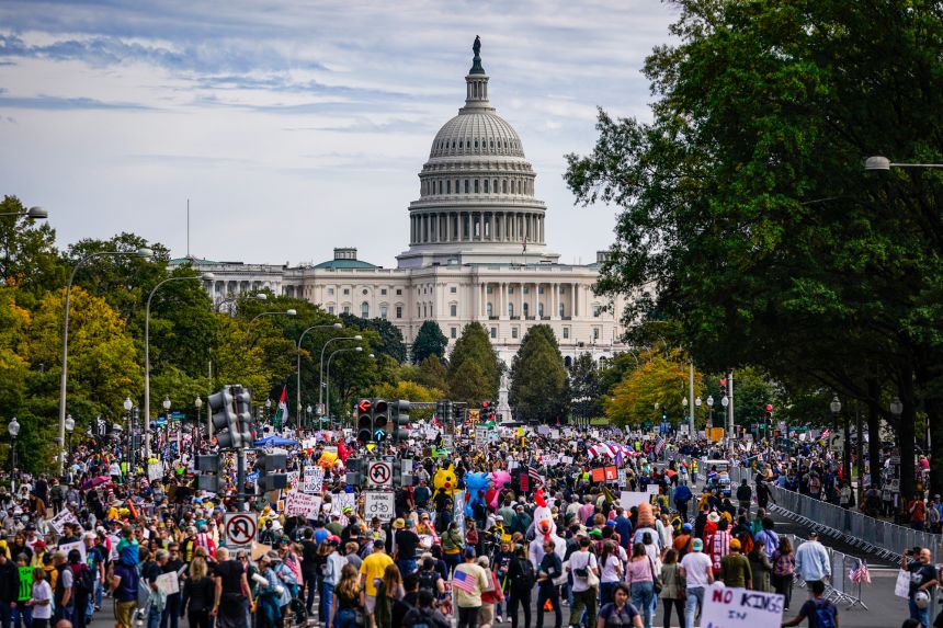 Protesters march along Pennsylvania Avenue during the second 