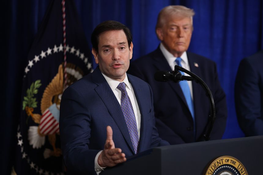 US Secretary of State Marco Rubio speaks during a press conference as President Donald Trump listens at Mar-a-Lago club on January 03, 2026, in Palm Beach, Florida.