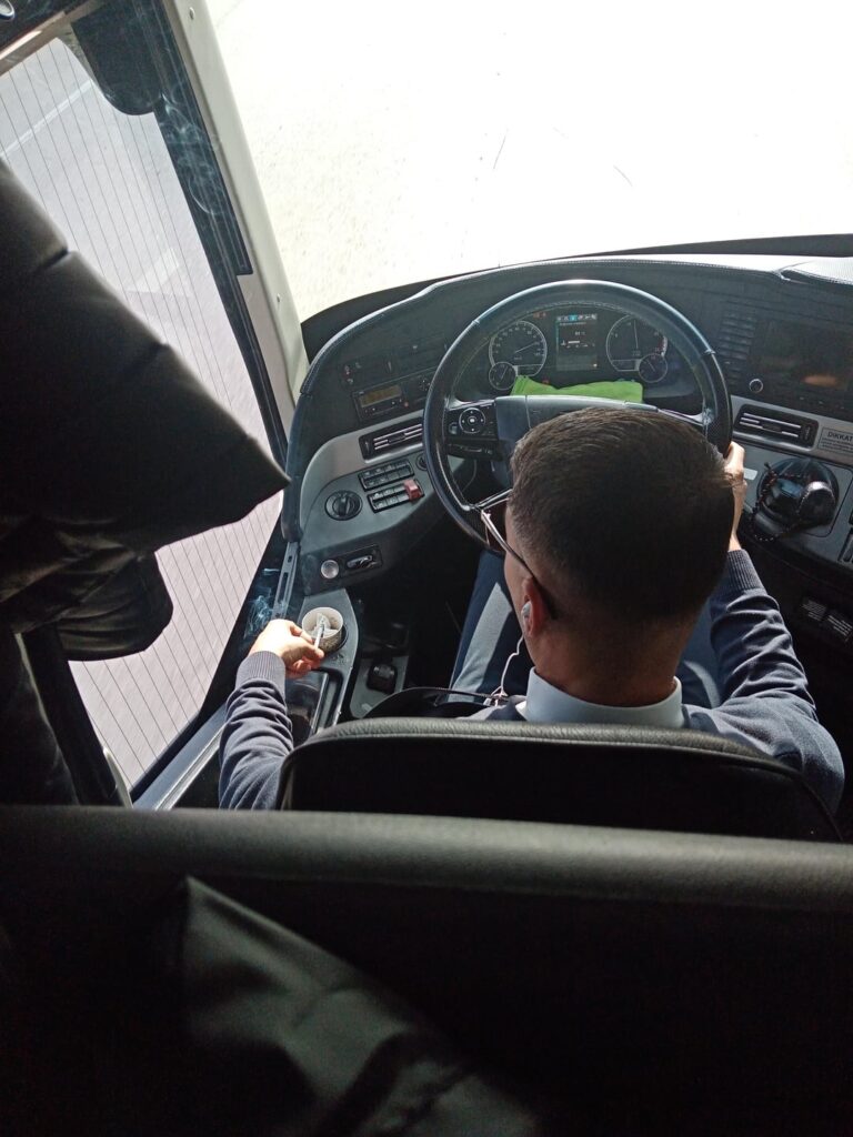 Kamil Koç driver smokes in the bus.