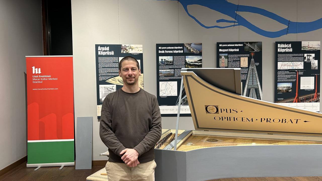 Hungarian harpsichord virtuoso Marton Borsanyi poses next to a historical harpsichord at the Liszt Institute Hungarian Cultural Center in Istanbul, Türkiye, Jan. 22, 026. (AA Photo)