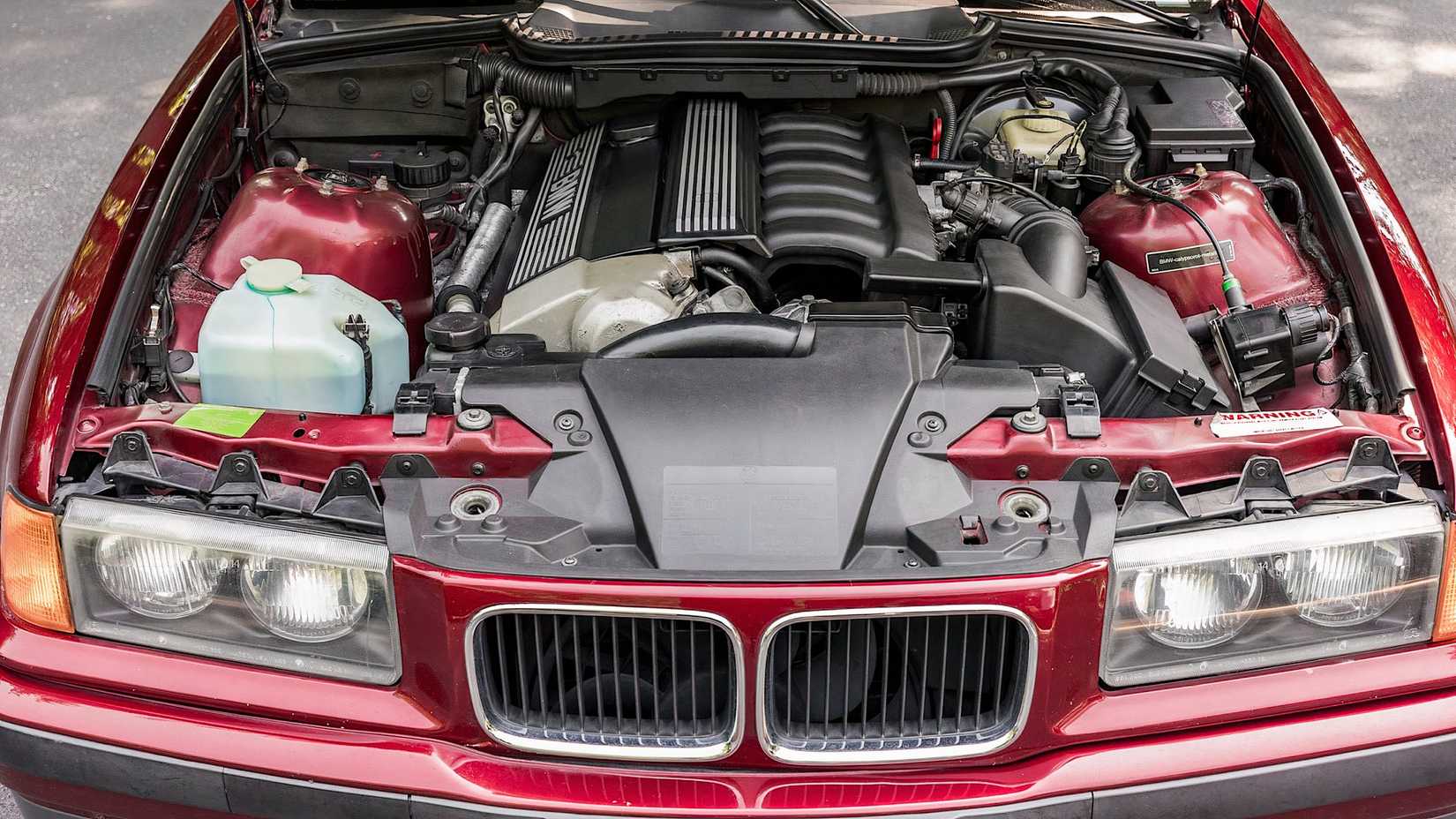 1995 BMW 325i engine bay showing BMW M50 engine