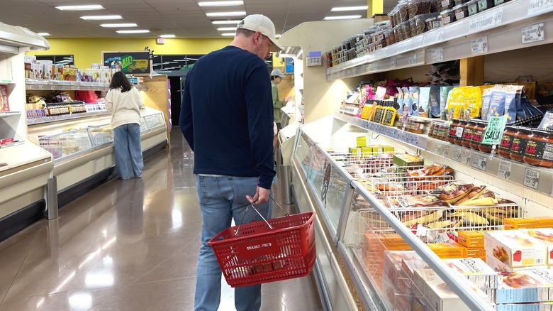 shoppers in a Trader Joe's freezer aisle