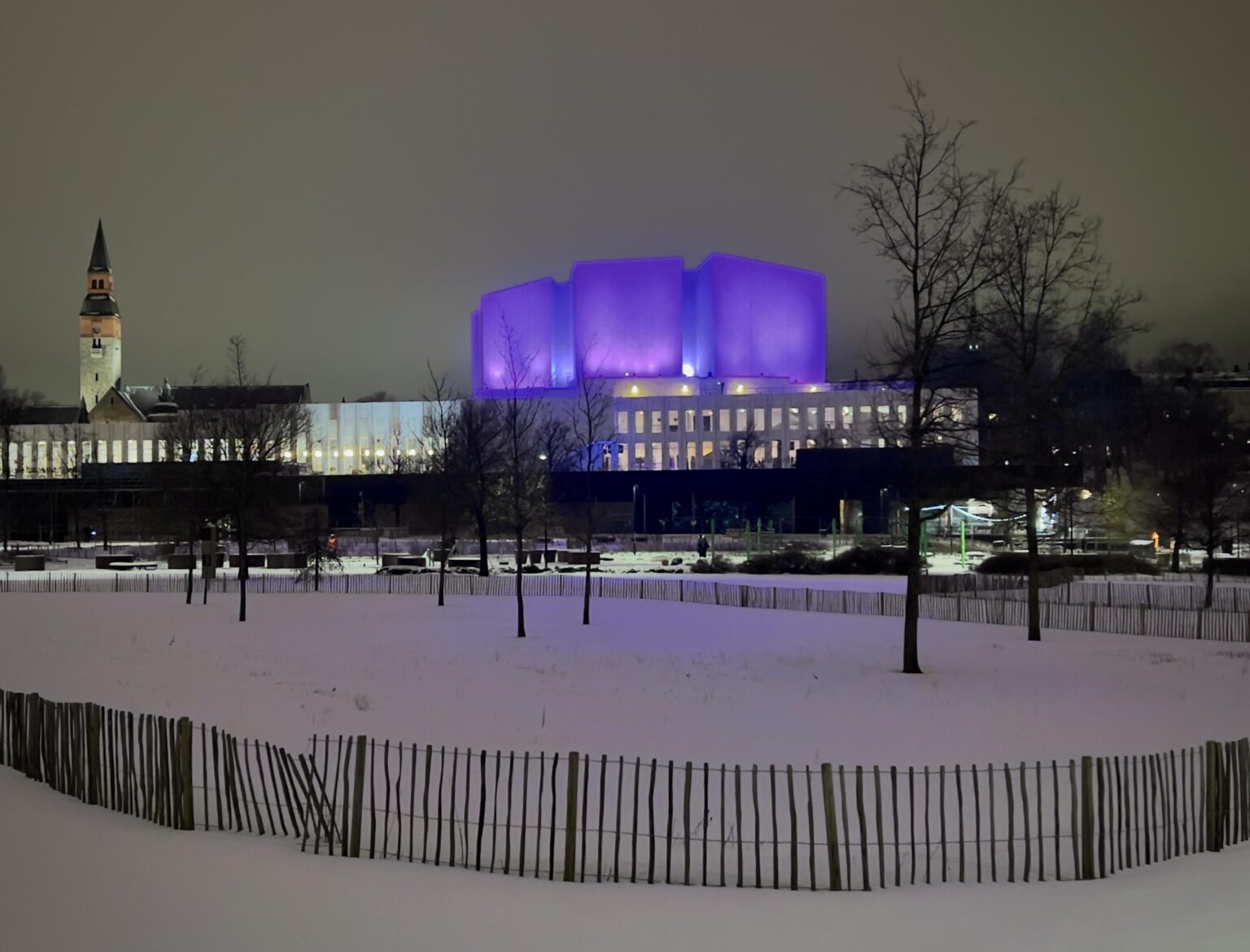 Finlandia Hall with evening lighting (and the tower of National Museum behind.)