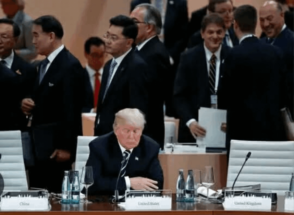 Give this photo from Davos a caption. I'll start. "The bully shows up at class reunion."