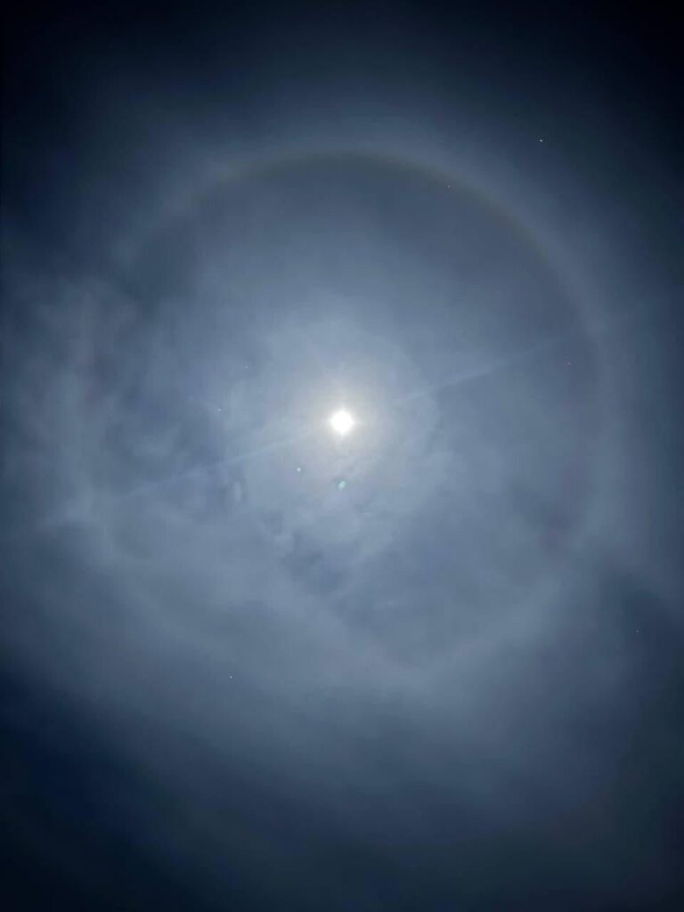 There's a strange ring around the moon, but it's beautiful.