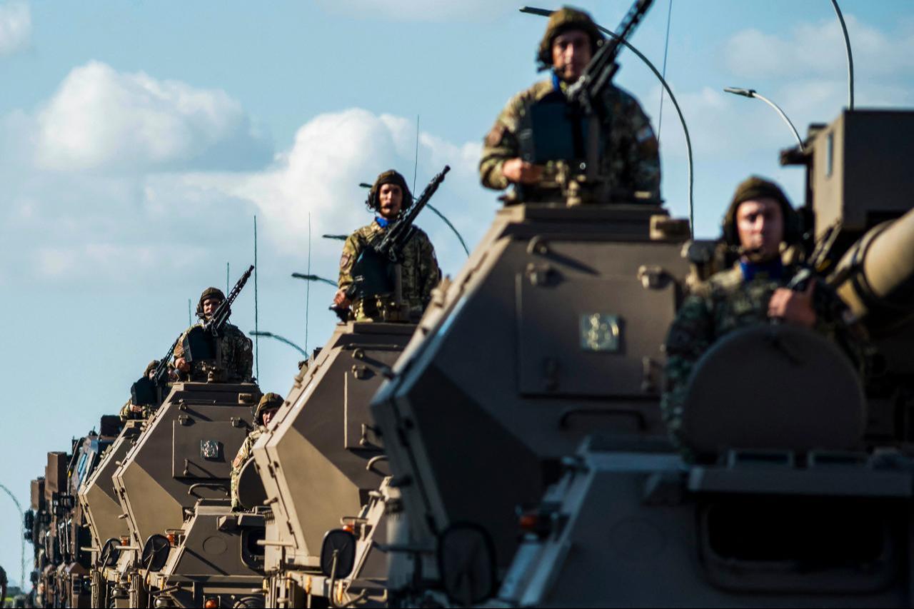 Soldiers stand on top of armoured vehicles during a military parade in Nicosia on October 1, 2025. (AFP Photo)