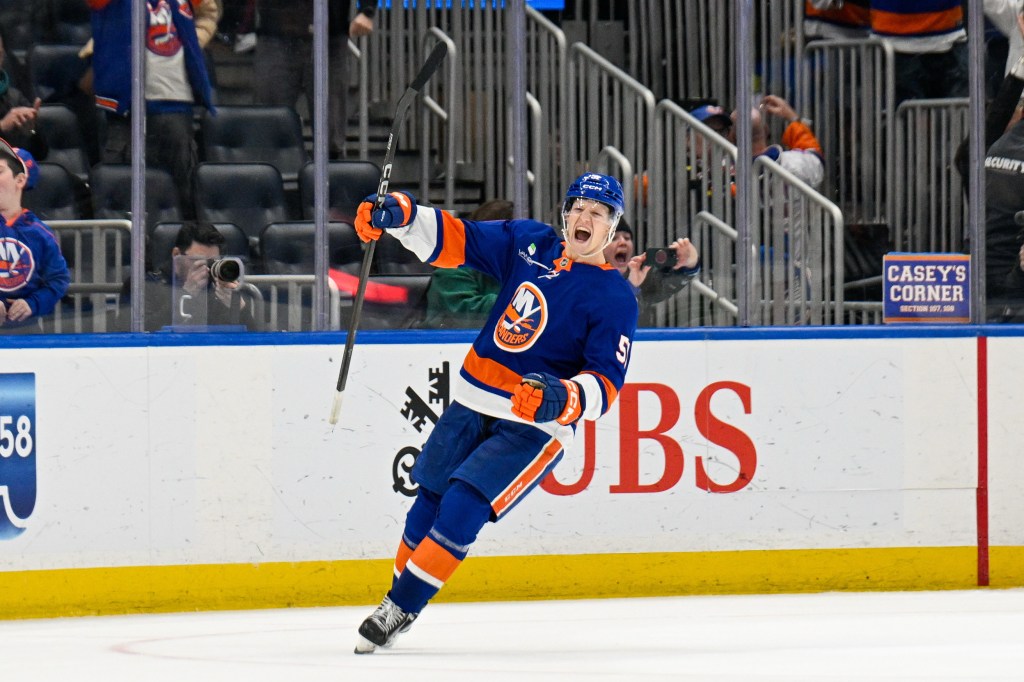 New York Islanders left wing Emil Heineman (51) celebrates his winning goal.