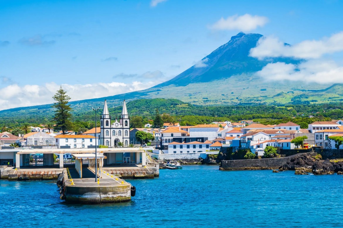 A View of Madalena port and volcano Mount Pico, on the coast of Pico island in the Azores, Portugal