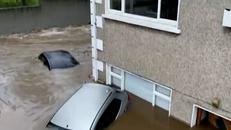 Cars partially submerged by flooding in Dublin