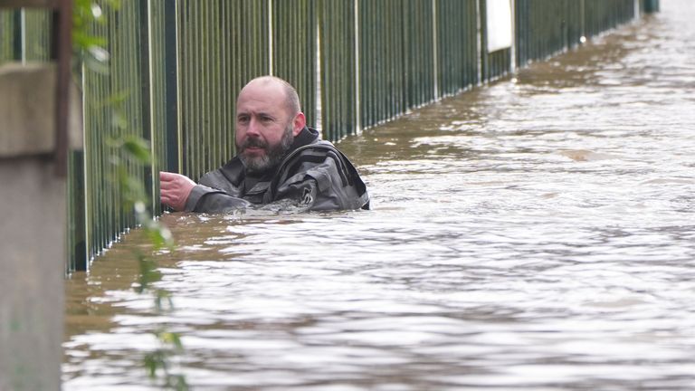 A rescue worker in floodwater in Enniscorthy, Co Wexford. Pic: PA