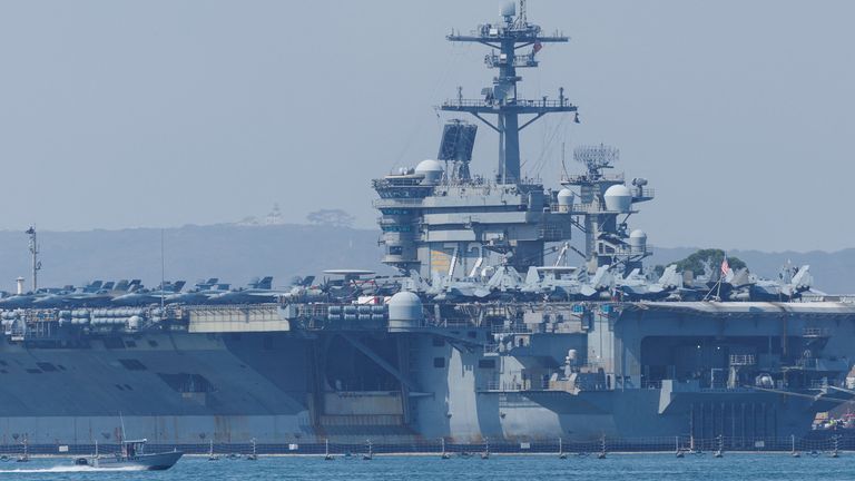The USS Abraham Lincoln (pictured) and several other ships are now in the region, raising fears of a US attack. Pic: Reuters