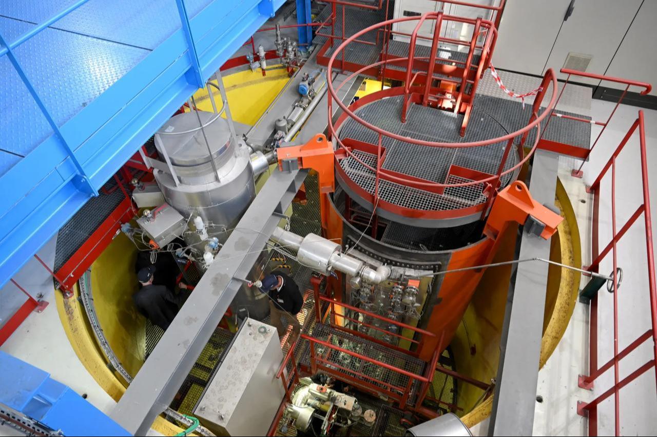 Engineers walk a section of a small modular reactor in Saint-Paul-les-Durance, France, date and time undisclosed. (AFP Photo)